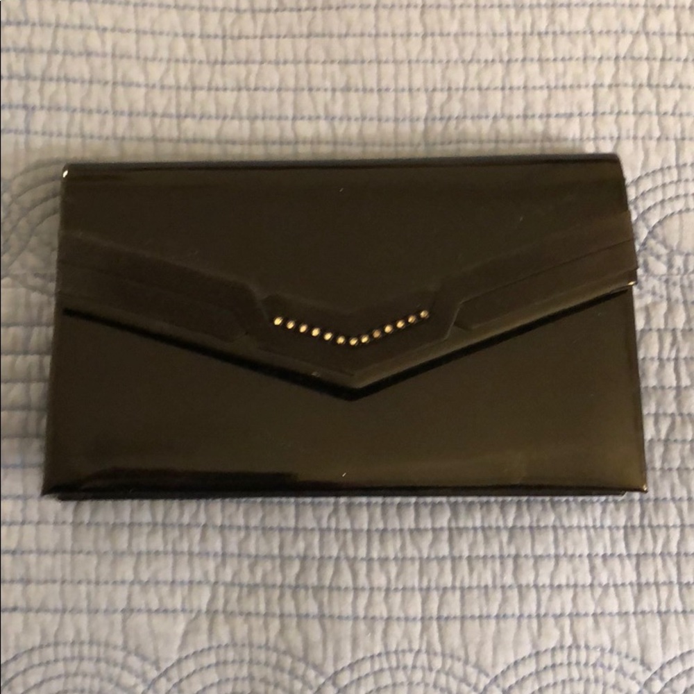 Black clutch bag with shoulder strap